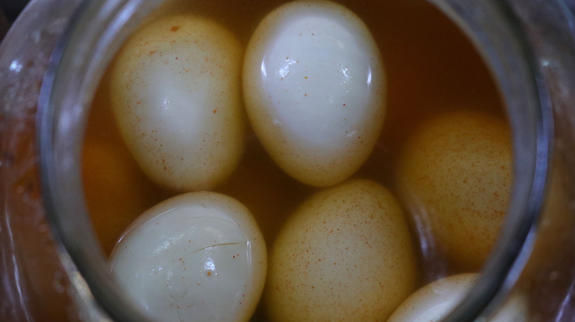 A jar full of pickled eggs